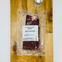 CreekReserve top sirloin steak on a cutting board