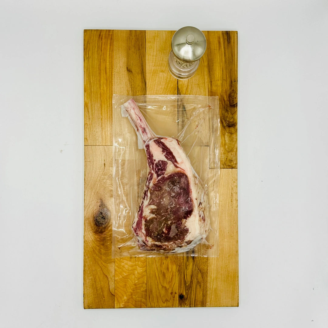 CreekReserve tomahawk ribeye steak on a cutting board