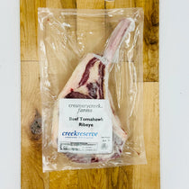 CreekReserve tomahawk ribeye steak on a cutting board