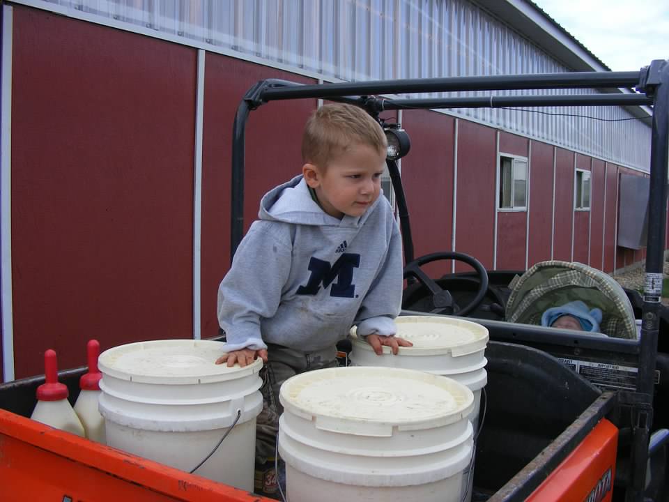 Jacob and Josh ready to help me feed calves