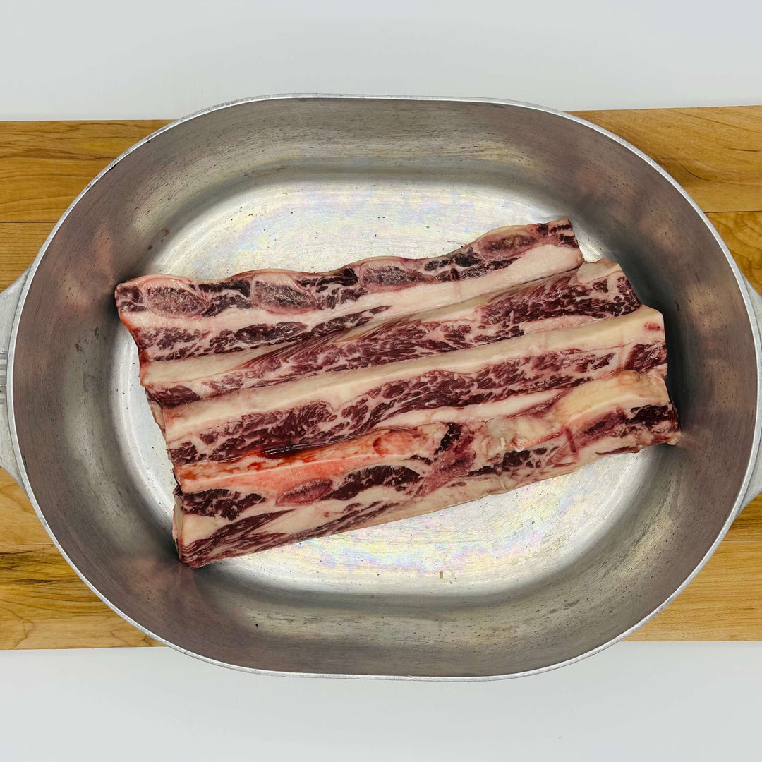 thin cut short ribs flanken style in an aluminum roaster pot