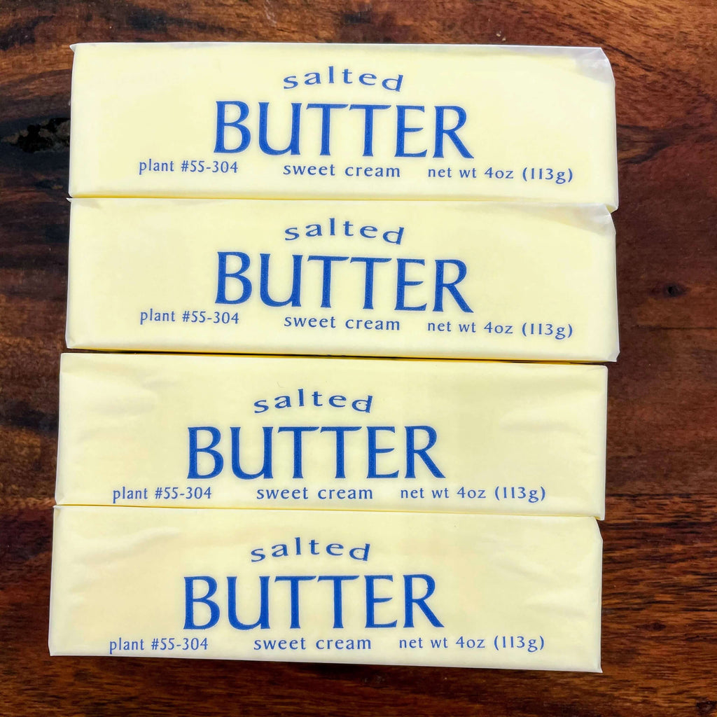 salted butter quarters lined up ready to use for butter boards or butter bombs
