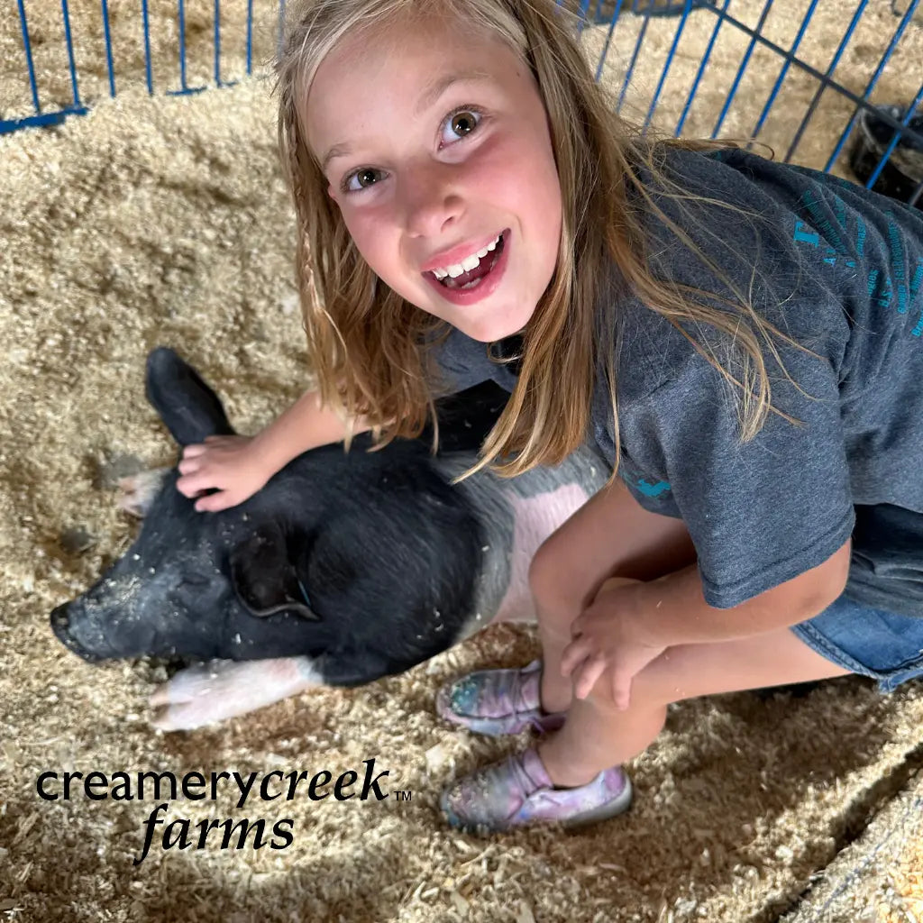 johanna is scratching her pigs head