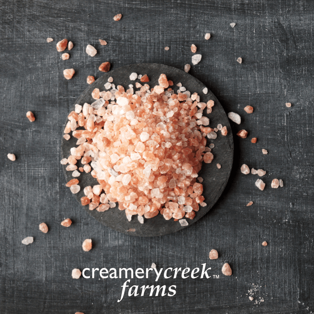 Himalayan Pink Salt coarse grind on a black background