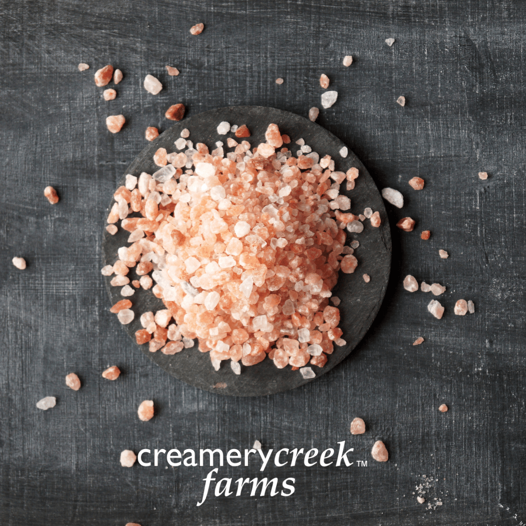 Himalayan Pink Salt coarse grind on a black background
