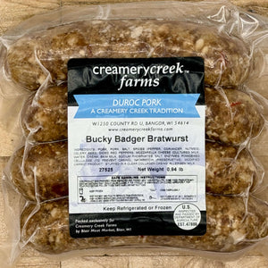Bucky Badger Bratwurst package with Creamery Creek Farms label on a wooden surface