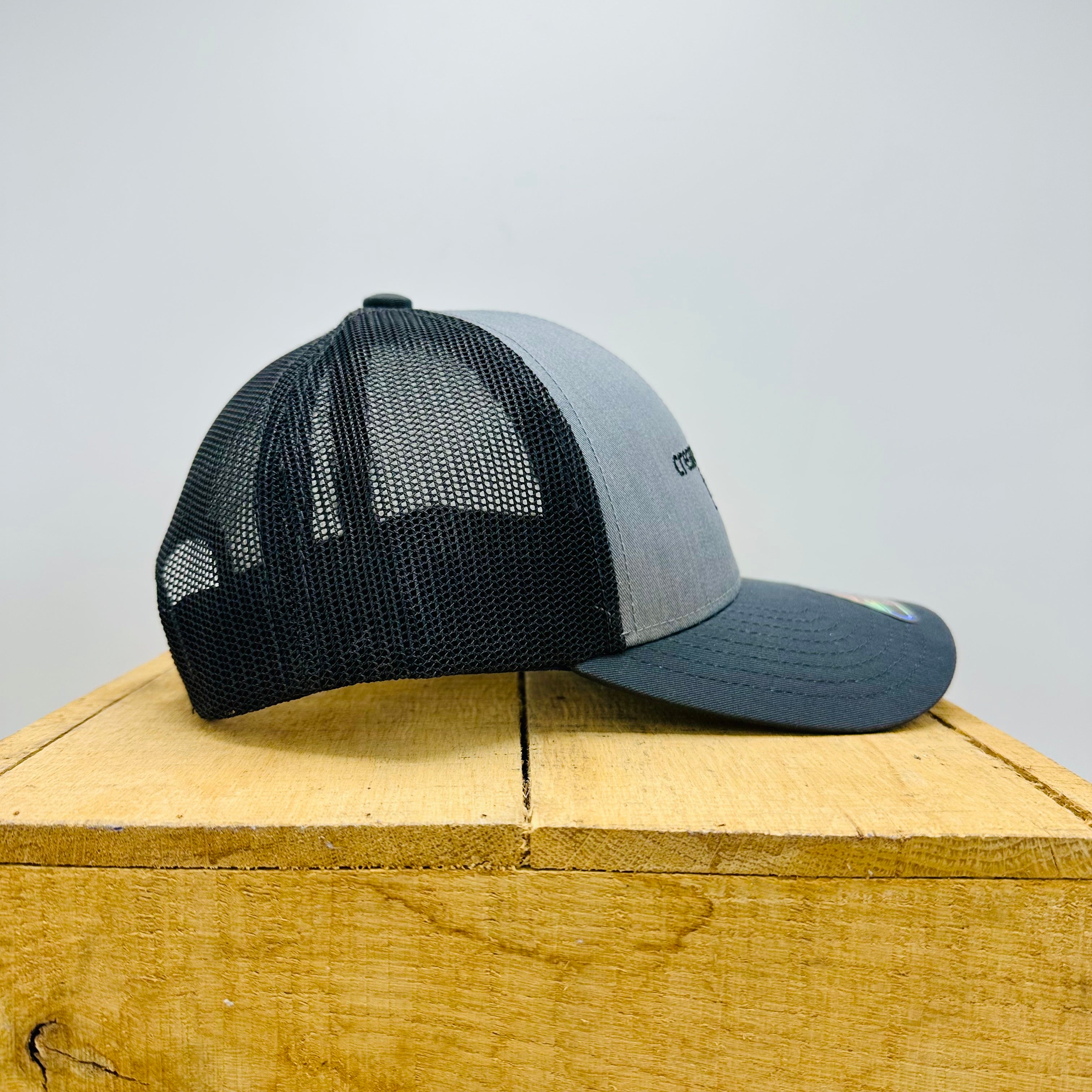 Grey trucker hat side profile
