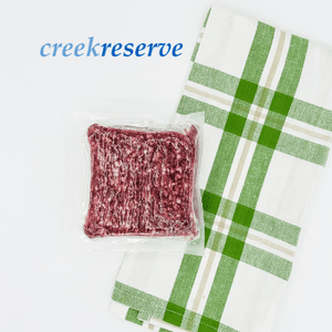 Packaged Creekreserve 28 Day Dry Aged Beef on handtowel