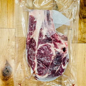 CreekReserve bone in ribeye steak on a cutting board