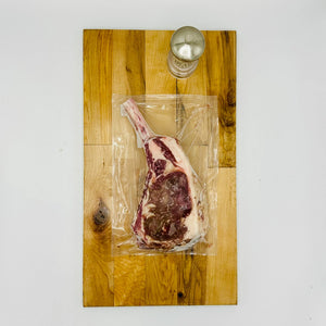 CreekReserve tomahawk ribeye steak on a cutting board