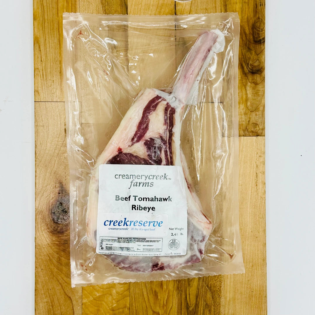 CreekReserve tomahawk ribeye steak on a cutting board