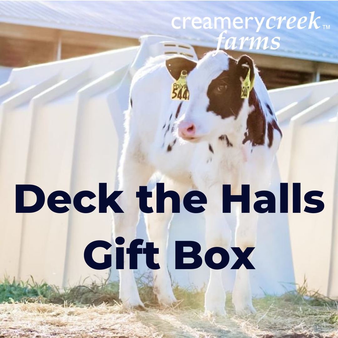 Calf standing in a pen with 'Creamery Creek Farms' text overlay.