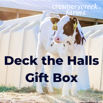 Calf standing in a pen with 'Creamery Creek Farms' text overlay.