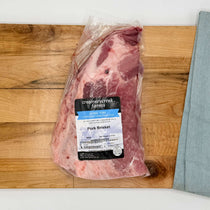 Pork brisket from Creamerycreek Farms on a wooden cutting board