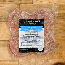 Packaged Maple Seasoned Pork Sausage Patties from Creamerycreek Farms on a wooden surface
