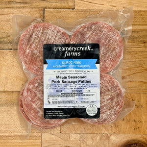 Packaged Maple Seasoned Pork Sausage Patties from Creamerycreek Farms on a wooden surface