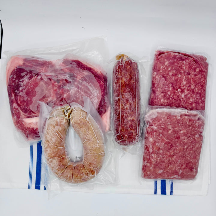 Contents of Pork Starter Bundle arranged on a kitchen towel