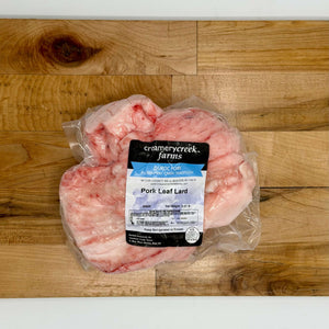 Packaged pork leaf lard with Creamery Creek Farms label on a wooden surface