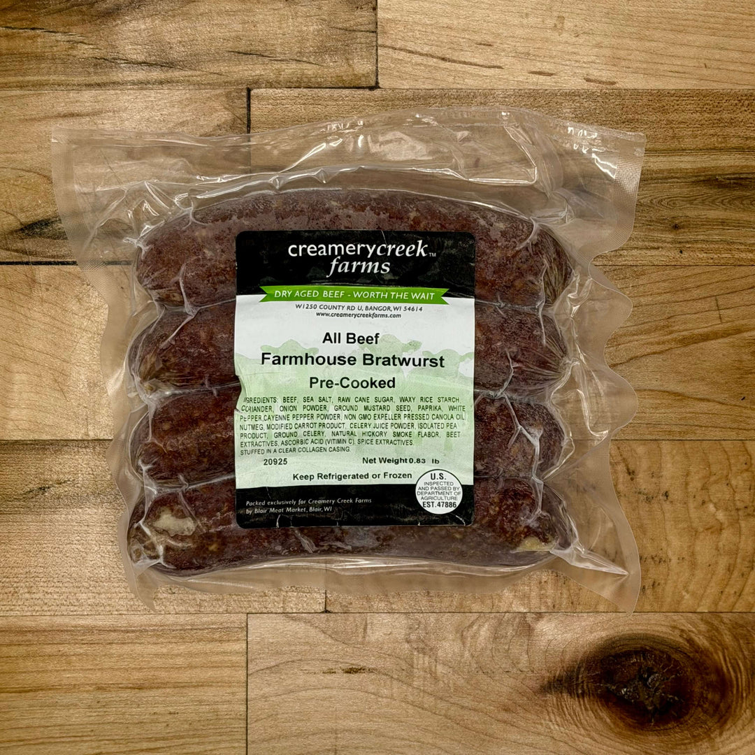 Packaged Farmhouse Bratwurst from Creamerycreek Farms on a wooden surface