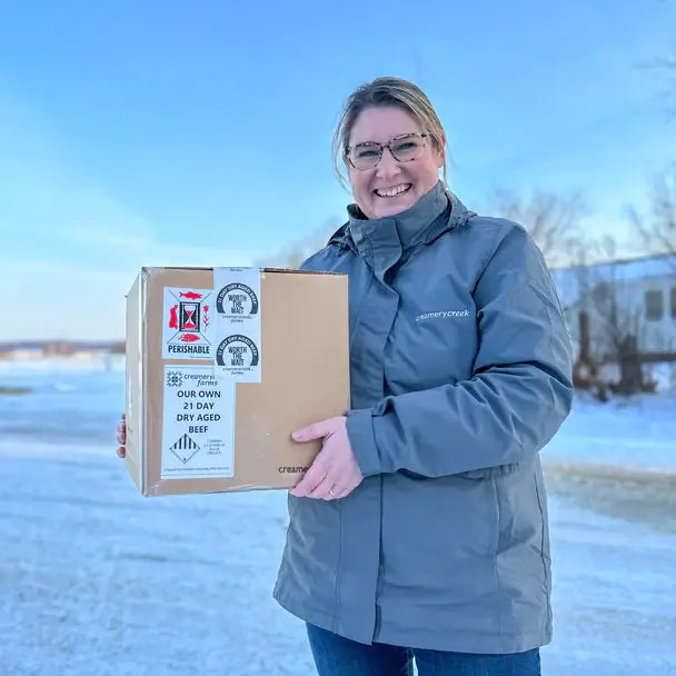 Woman holding package in winter