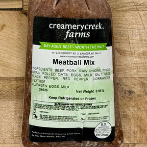 Packaged meatball mix from Creamery Creek Farms on a wooden surface