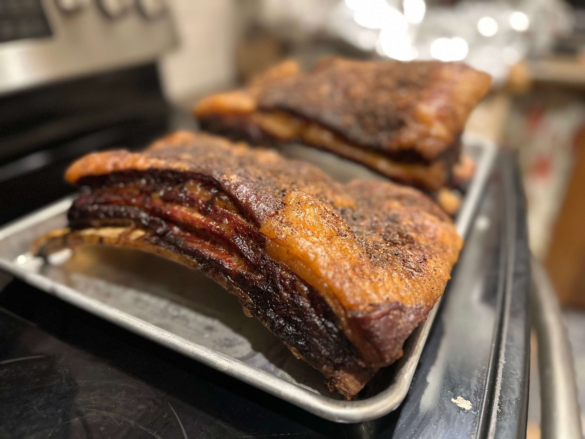 SMoked Short Rib Platesbon a metal tray in the Creamery Creek kitchen