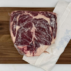 Pair of Dry Aged Ribeyes on a cutting board